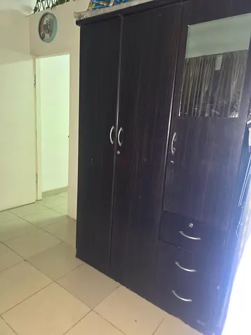 Dark Wood Three Door Wardrobe with Mirror and Drawers