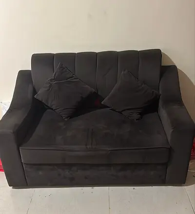 Comfortable Black Two Seater Sofa with Pillows