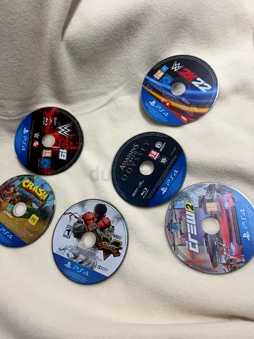 Bundle of 7 PS4 Game Discs - WWE 2K19, The Crew 2, Assassins Creed Odyssey, Crash, UFC  more
