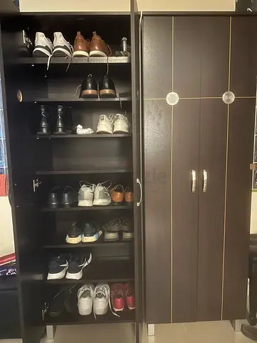Dark wood shoe cabinet with multiple compartments - good condition