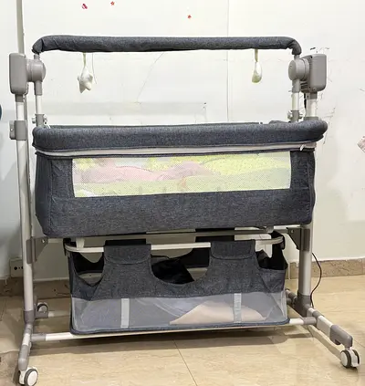 Gray Auto swing Baby Bassinet / Crib with Storage and Wheels