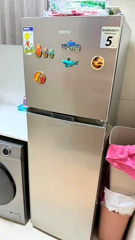Silver double-door refrigerator, good working condition