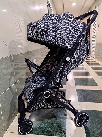Used one time Christian Dior Travel Stroller New Condition One hand folding mechanism Light waight