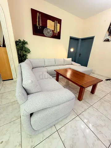 Light grey L-shaped fabric sofa New