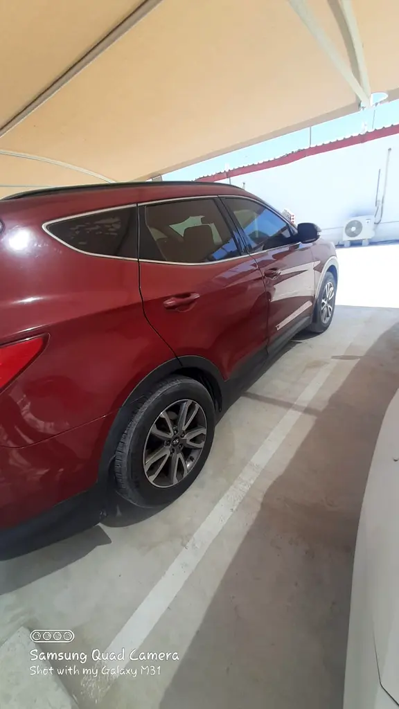 Hyundai Santa Fe 2015 — photo 1 of 10