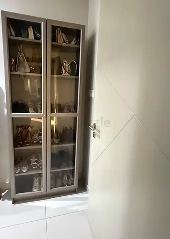 IKEA Tall glass-front storage cabinet — ideal for shoes and bags
