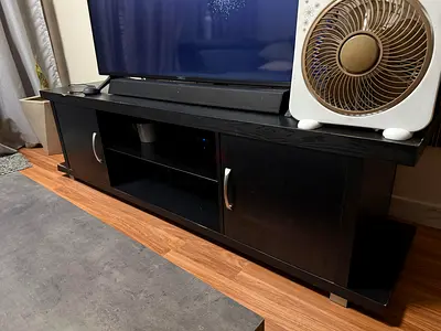 Black wooden TV cabinet with storage - good condition