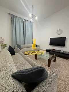 Luxury apartment, second occupancy, one bedroom and living room with a balcony and open view. Ajman