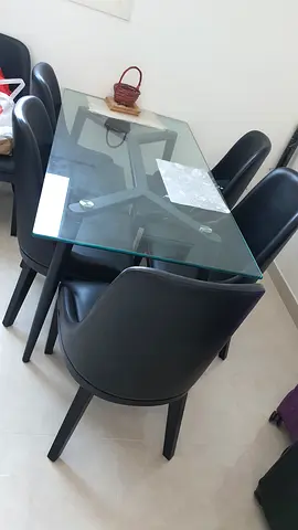 Modern Glass Top Dining Table with Six Black Chairs