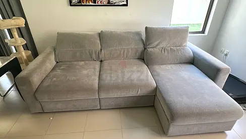 Light grey L-shaped 3-seater sofa with chaise lounge, good condition
