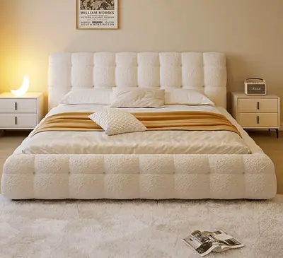 Queen upholstered bed with padded headboard and footboard - cream