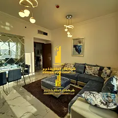 Beautiful furnished one-bedroom apartment with hotel-style furnishings for monthly rent in Ajman - A