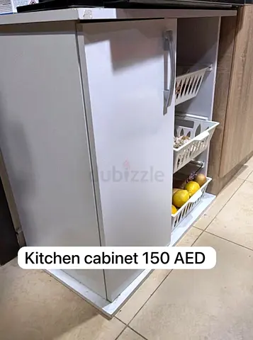 White kitchen cabinet with pull-out baskets - used, good condition