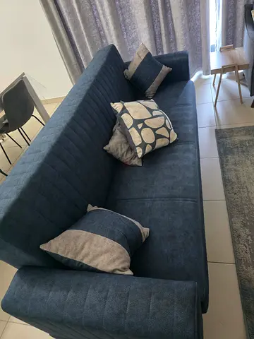 Dark grey 3-seater fabric sofa bed in good condition
