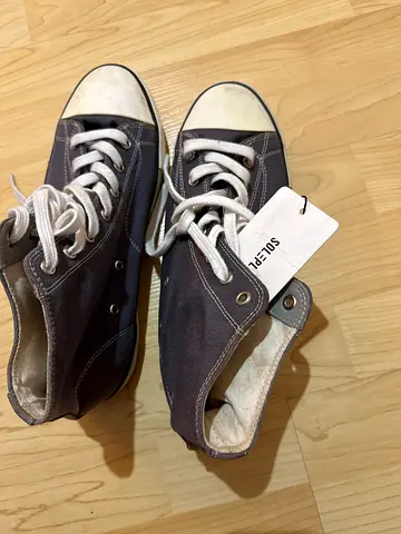 Used grey high-top canvas sneakers, size not specified, lightly worn