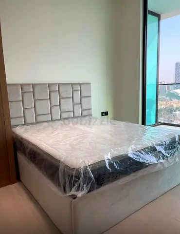 Brand new grey upholstered bed with storage