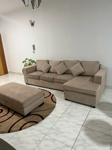 Light beige L-shaped sectional sofa with ottoman - good condition