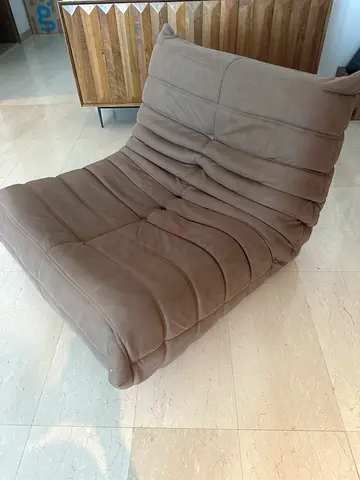 Single modern beige lounge chair — comfy occasional chair