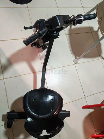 Childs ride-on tricycle attachment with handle and seat - used