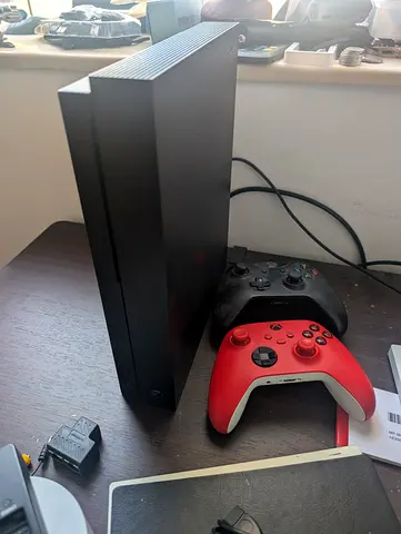 Xbox One X console with 2 wireless controllers (black + red) - 2TB hd and  games