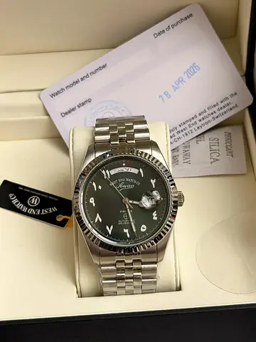 Mens stainless steel automatic wristwatch with green dial and Jubilee bracelet