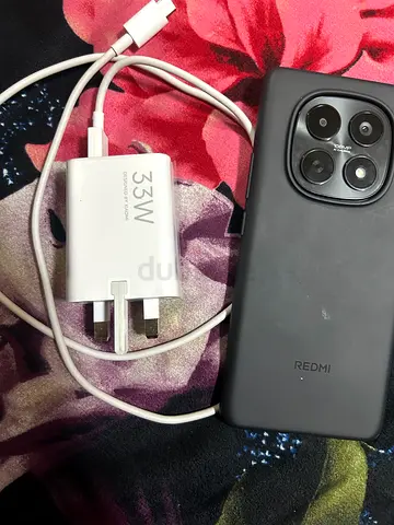Redmi smartphone with 33W Xiaomi fast charger and cable