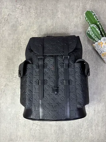 Louis Vuitton Black embossed designer leather backpack - good condition
