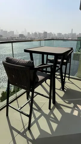 Outdoor high bar table with two cushioned bar stools - good condition