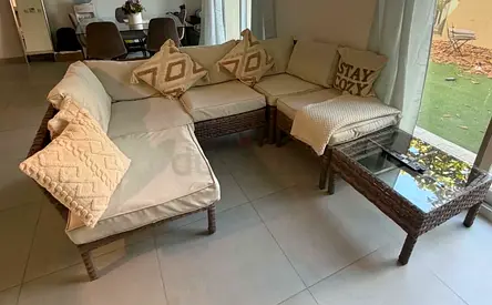 FREE TO COLLECT TODAY - outdoor brown rattan sofa and glass top table with cushioned seats.