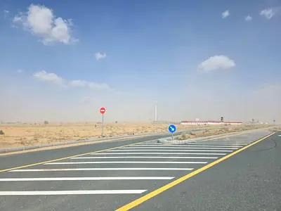 Commercial land for sale in Rawdat Al Qurt, Al Ruwaidat suburb, Sharjah.