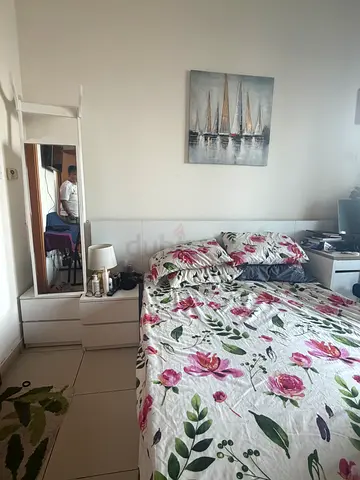One queen White bed with  with 2 bedside table - good to average  condition