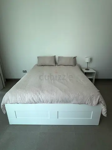 White storage double bed frame with mattress - minimal design