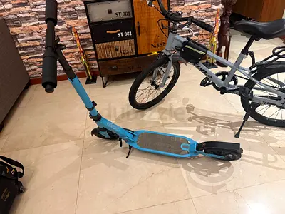 Light blue adult kick scooter — used, good working condition. Metal frame and extremely durable