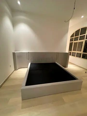 Grey fabric platform bed frame with headboard — Good condition