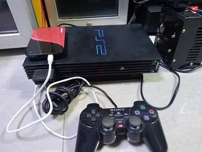 Playstation 2 Fat with loaded 100+ games