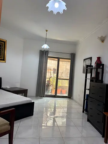 Mankhool next to golden sands 1  furnished room with balcony for Indian single male rent 3k