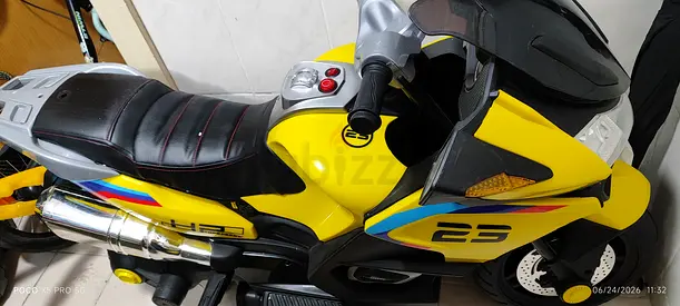 Kids electric ride-on motorcycle - yellow, battery powered, good condition