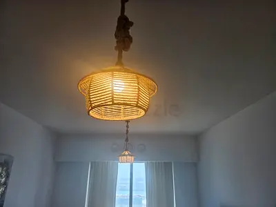 Pair of woven rattan pendant lights — natural boho ceiling lamps