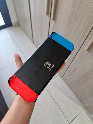 Nintendo Switch Oled console with Neon Red  Blue Joy-Cons - Good working condition only console
