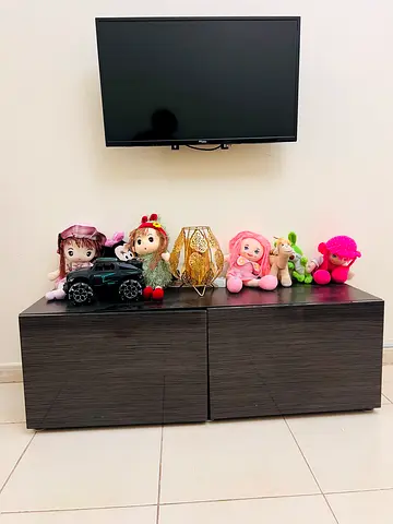 Low modern TV cabinet / media unit - dark wood finish