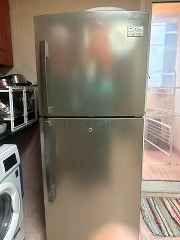 Double-door stainless steel refrigerator - good working condition