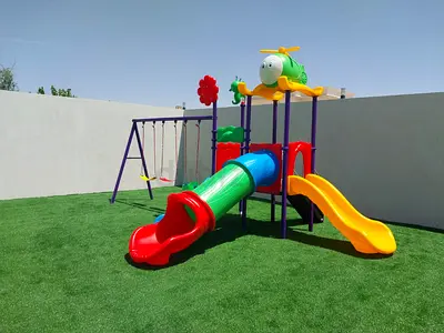 Outdoor kids playset with slides, tunnel and swings - good condition