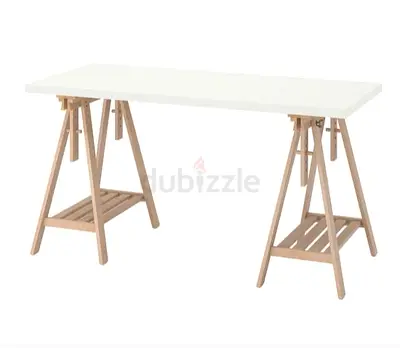 IKEA-style white trestle desk with wooden sawhorse legs