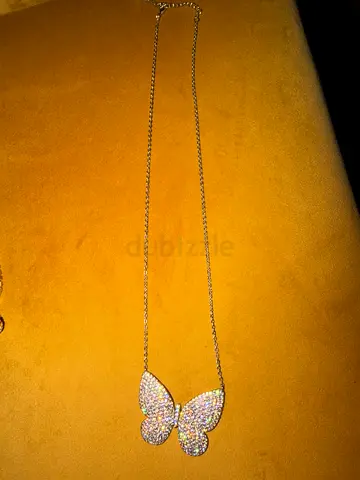 Silver-tone butterfly pendant necklace with crystal pavé accents