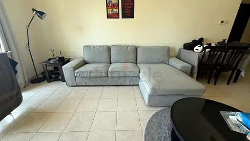 Light grey L-shaped 3-seater sofa with chaise, good condition
