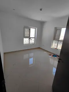 A room and a hall with central air conditioning in Muwaileh Commercial, behind the schools. A lively