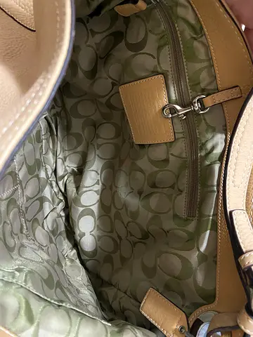 Beige Coach leather shoulder bag with signature fabric lining