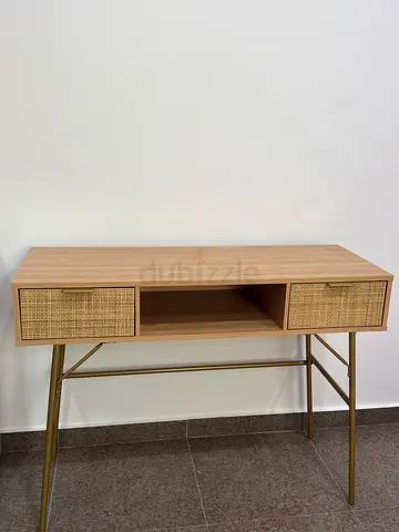 Light wood console table with cane drawer fronts and brass legs