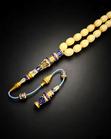 A mammoth ivory prayer bead set (tasbih), consisting of 33 beads