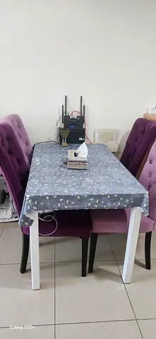 Dining table with 4 upholstered chairs - good condition